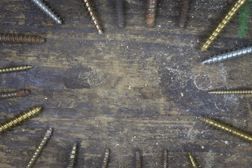 Many screws on a workbench