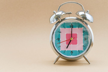 Alarm clock is showing time for 7 AM