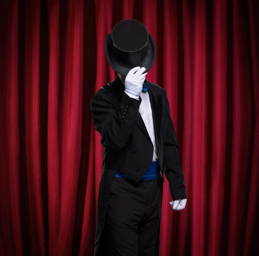 magician with top hat on stage