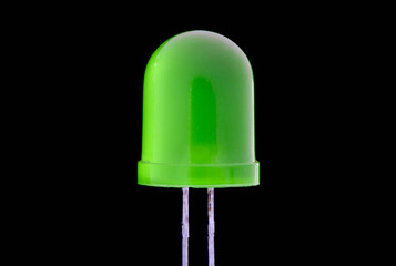 Macro of mini  green Acrylic LED bulb with black background - Low key