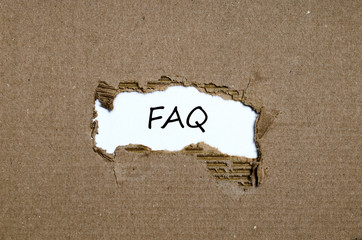 The word faq appearing behind torn paper