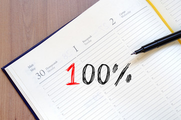 One hundred percent symbol on notebook