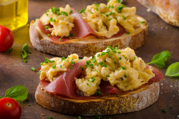 Delicious toasted bread with scrambled eggs