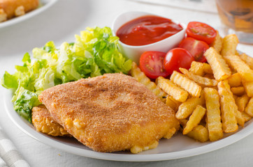 Fried cheese with french fries and lettuce