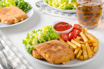 Fried cheese with french fries and lettuce