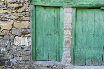 Green door, wood and stone houses in the province of Zamora in S