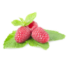 Raspberries and mint leaves on a white background. Isolated