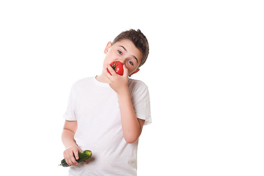 Healthy boy with food on a white background in the studio, healt