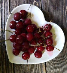 Cherries in a heart shaped bowl