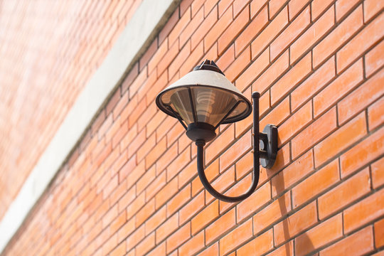 Lamp on the brick wall vintage style outdoor walkway walking  university or college space decoration.
