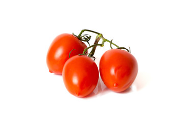 three tomatoes on white