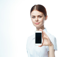 Business woman showing a phone