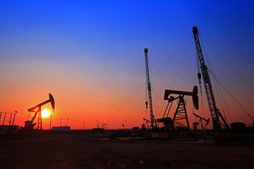 Sunset time of oil pump, oil industry equipment