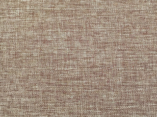 Closeup surface abstract fabric pattern at the brown fabric carpet at the sofa textured background