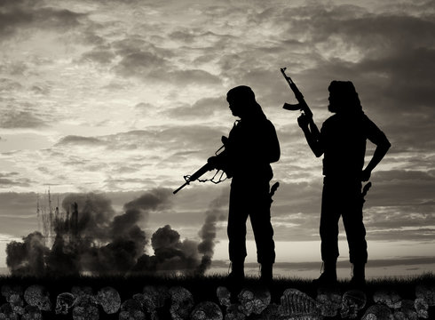 Silhouette of men holding rifles with explosions and smoke in background