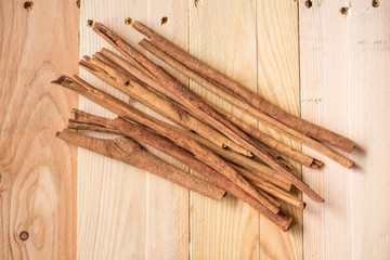 Cinnamon Stick on Wood Background.