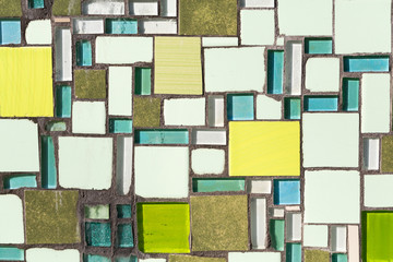 Colorful mosaic on the wall, abstract glass background.