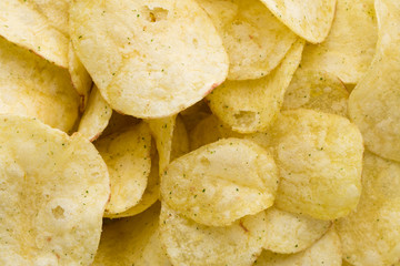 Close up potato chips on top view background.