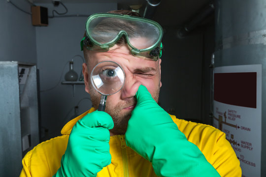Man in the lab with magnifier