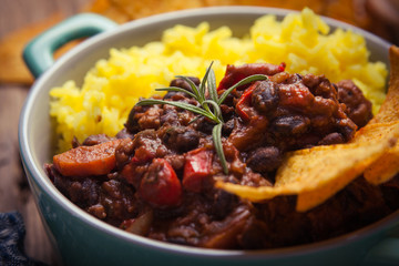 Homemade chilli con carne with beans, pepper and rice