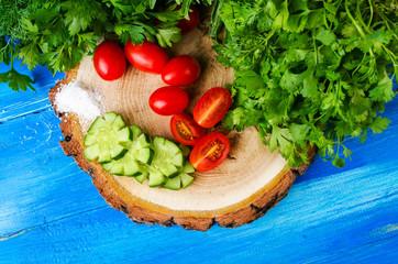 Cucumbers, tomatoes, dill and parsley.