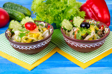 Salad with vegetables, and olives.