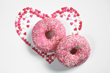 Two pink donuts