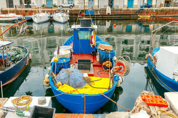Fototapeta na wymiar Genoa. Fishing boats in the seaport.