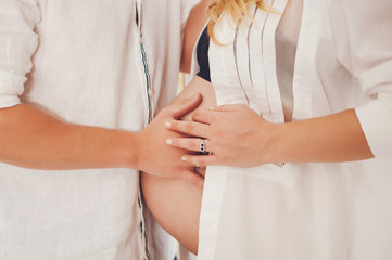 Obraz na płótnie Canvas Couple expecting baby and man his fatherhood