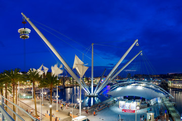 Panoramic elevator Bigo in the ancient port of Genoa on Mediterranean Sea, at night, Italy.