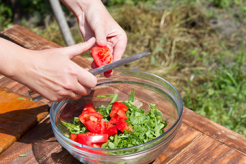 fresh vegetable salad in a plate on a wooden table