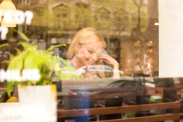 A beautiful young woman in the window