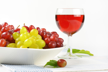 fresh grapes and glass of wine or juice