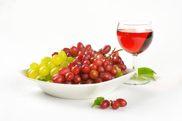 fresh grapes and glass of wine or juice