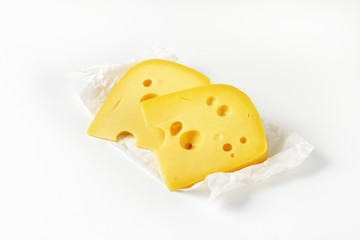 wedges of yellow cheese with eyes