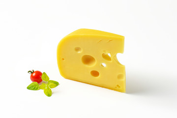 wedge of yellow cheese with eyes