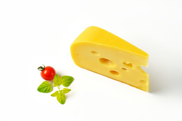wedge of yellow cheese with eyes