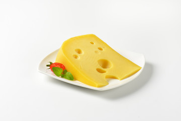 wedge of yellow cheese with eyes