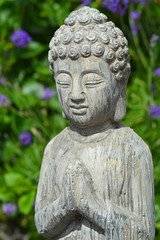 Fototapeta na wymiar Buddha statue in a lavender garden