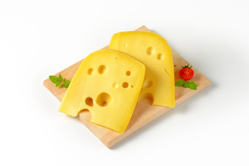 wedges of yellow cheese with eyes