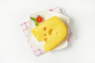 wedge of yellow cheese with eyes