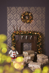 Christmas interior with fireplace, wreath and garland