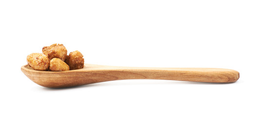 Spoon full of peanuts isolated