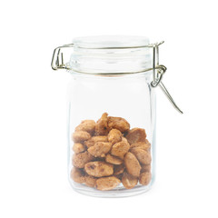 Glass jar filled with peanuts isolated