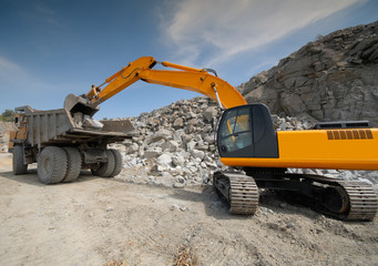 excavator in a granite quarry