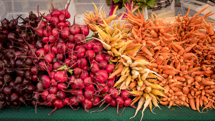 Carefully stacked vegetables at a local farmers market