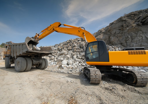 Excavator In A Granite Quarry