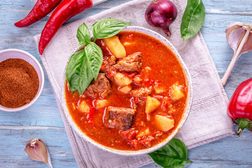 Hungarian goulash top view on cyan background
