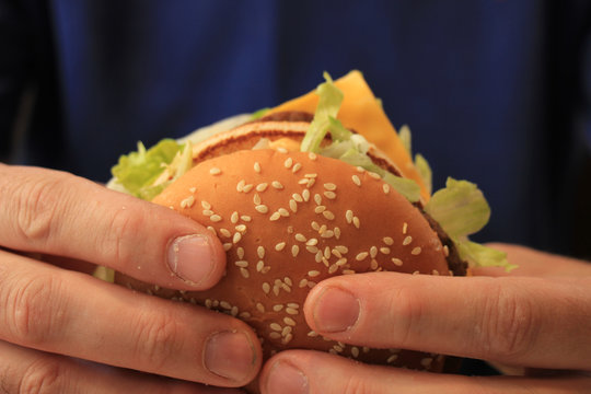Man holding hamburger