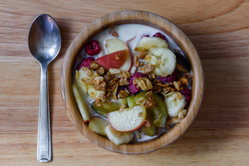 Bowl of milk with muesli, berries and fruits